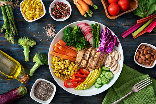 healthy eating and diet concepts. top view of spring salad shot from above on rustic wood table. - food stock pictures, royalty-free photos & images