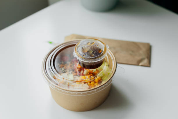healthy food lunch in kraft paper carton. concept of eco friendly disposable dish. chicken, corn, tomatoes, celery and sause. take away delivery. environment protection - junk food stock pictures, royalty-free photos & images