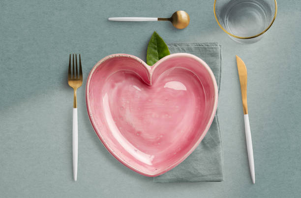 heart shape plate in table setting - home decoration stock pictures, royalty-free photos & images