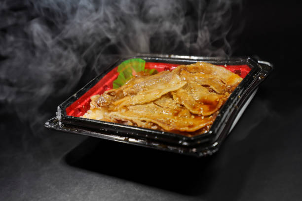 hearty and warm: reheated yakiniku bento - junk food stock pictures, royalty-free photos & images