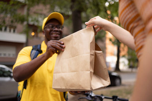 here's your delivery! - junk food stock pictures, royalty-free photos & images