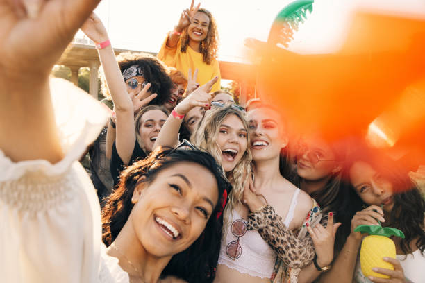 high angle view of cheerful friends enjoying in music event during summer - concert stock pictures, royalty-free photos & images