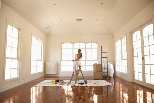 hispanic woman painting room - home decoration stock pictures, royalty-free photos & images
