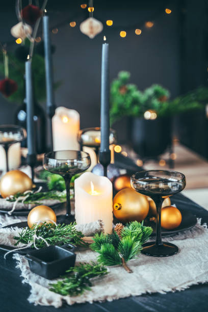 holiday table set up with candle lights, fir tree branches and christmas balls - home decoration stock pictures, royalty-free photos & images