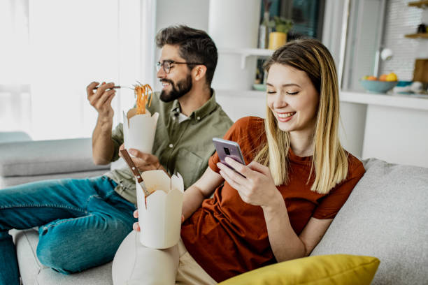 home delivery of food for young couple - food stock pictures, royalty-free photos & images