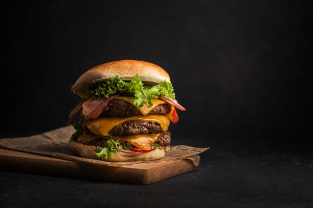 homemade cheeseburger with meat bacon salad cheese and ketchup - junk food stock pictures, royalty-free photos & images