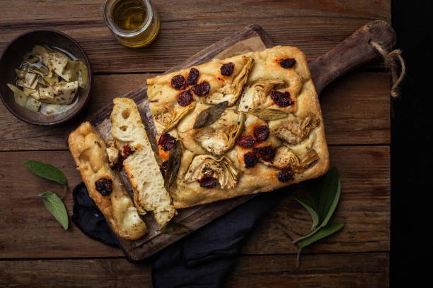 homemade garden focaccia bread olive oil herbs tomatoes artichoke - garden decoration stock pictures, royalty-free photos & images