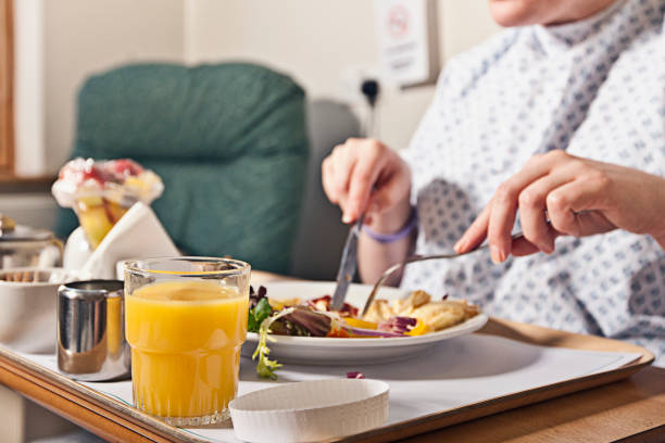 hospital patient eating dinner - food stock pictures, royalty-free photos & images