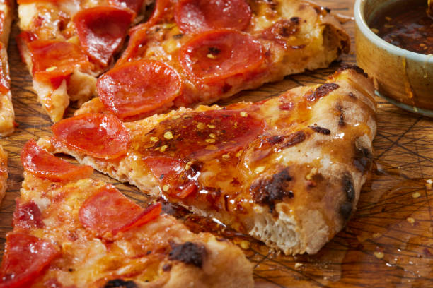hot honey pepperoni pizza - junk food stock pictures, royalty-free photos & images