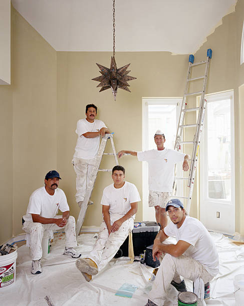 house painters in freshly painted room - home decoration stock pictures, royalty-free photos & images
