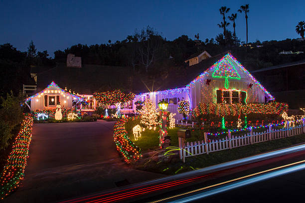 house with abundant exterior christmas lights - garden decoration stock pictures, royalty-free photos & images