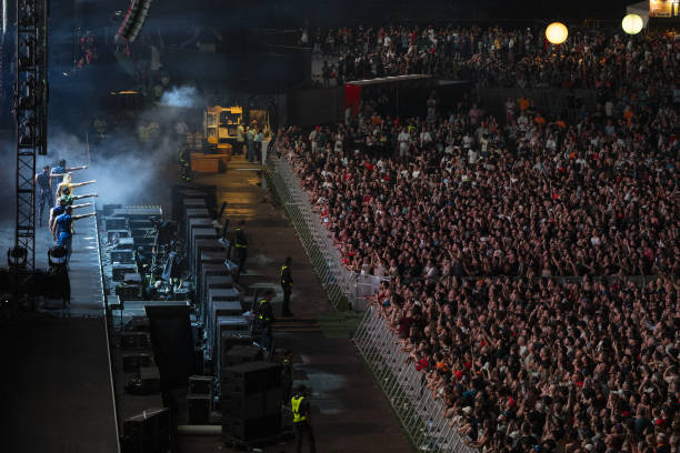 Hundreds of fans watch Australian pop star Kylie Minogue's concert during the Formula 1 Singapore Grand Prix at the Marina Bay Street Circuit in...