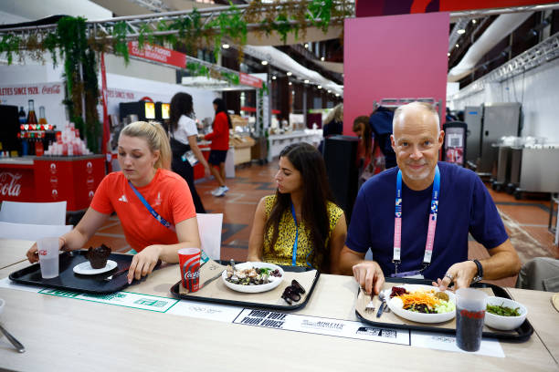 Hungary Minister of Defense and Sport Kristof Szalay-Bobrovniczky sits for a meal with Fencing Bronze medalist Eszter Muhari as he visits Hungarian...