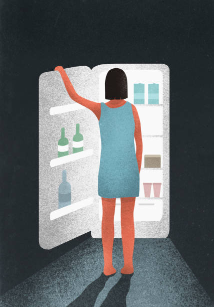 hungry woman standing at open refrigerator - junk food stockfoto's en -beelden