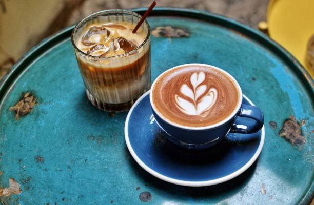 ice and hot cafe latte - coffee stock pictures, royalty-free photos & images