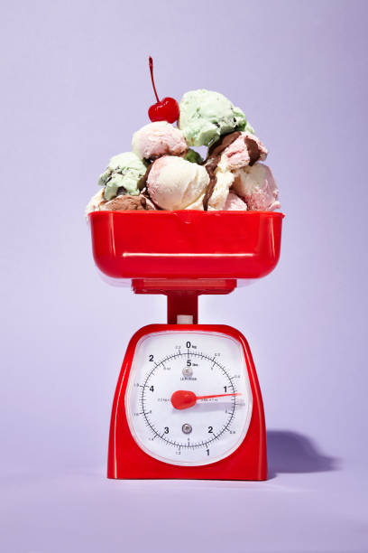 ice cream scale - junk food stockfoto's en -beelden