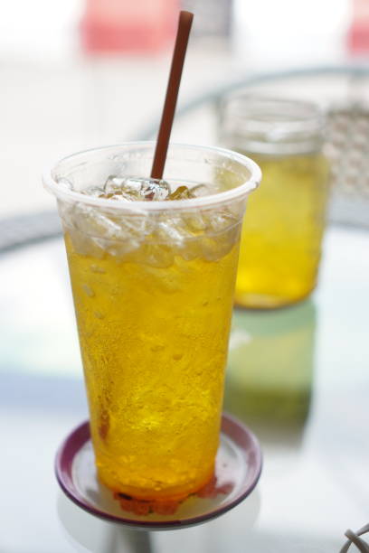 ice yuzu soda in plastic cup - junk food stock pictures, royalty-free photos & images