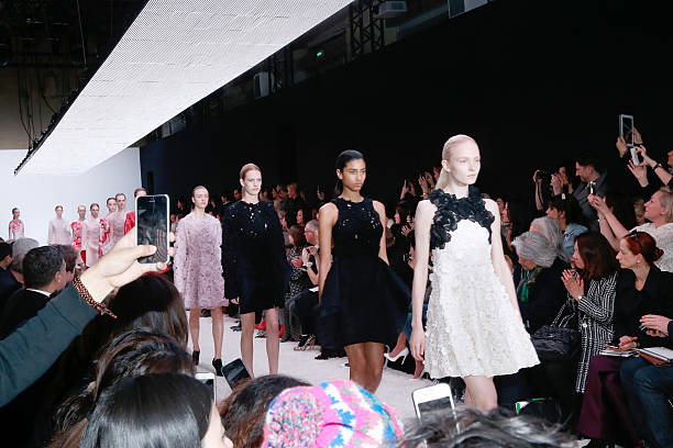 Illustrationn View of People taking pictures and movies with their smartphone whyle the Giambattista Valli show as part of the Paris Fashion Week...