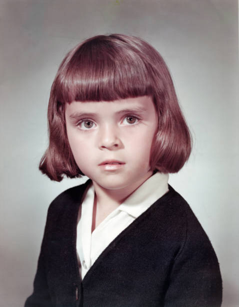 image taken in the 60s: studio headshot of a schoolgirl - hairstyle stock pictures, royalty-free photos & images
