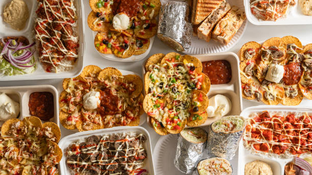 indian fusion food table. - junk food stock pictures, royalty-free photos & images