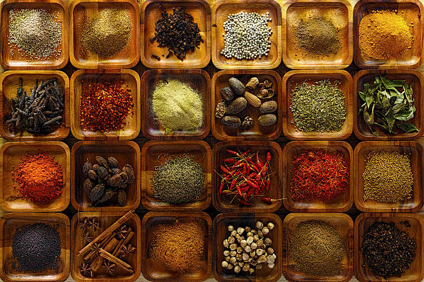 indian spices in wooden trays. - food stock pictures, royalty-free photos & images