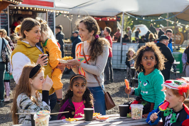 indulging in sweet halloween snacks - food stock pictures, royalty-free photos & images