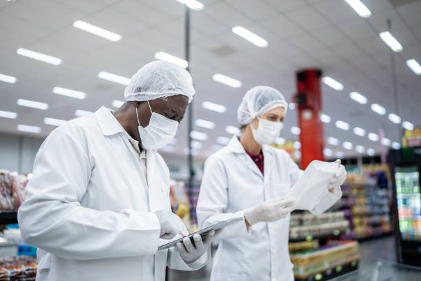 inspectors analyzing the food in the supermarket - food stock pictures, royalty-free photos & images