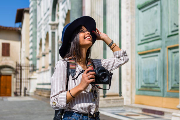 italy, florence, happy young tourist with camera looking up - travel stock pictures, royalty-free photos & images