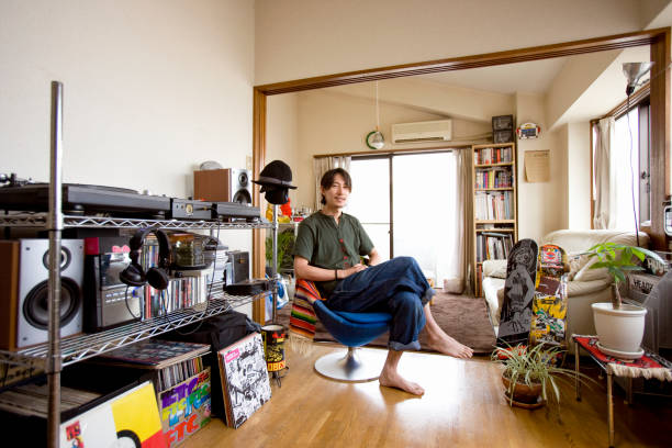 japanaese man in his aparment - home decoration stock pictures, royalty-free photos & images