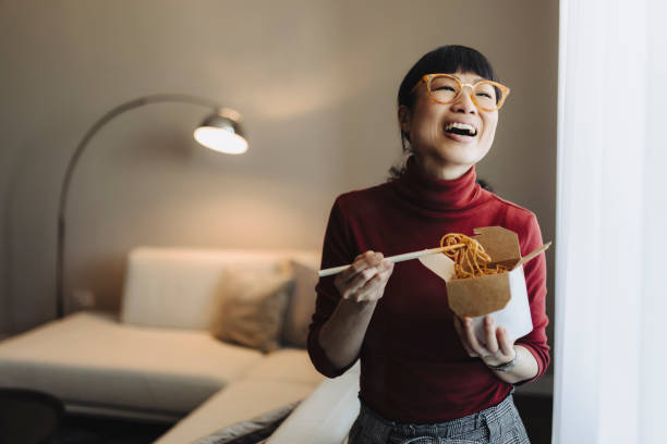 japanese eating pasta with chopstick - junk food stock pictures, royalty-free photos & images