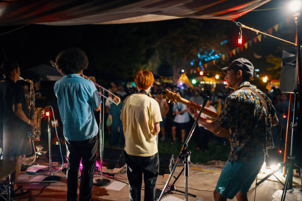jazz group playing a live concert at an outdoor music festival - concert stock pictures, royalty-free photos & images