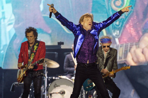 July 2022, North Rhine-Westphalia, Gelsenkirchen: Ron Wood , Mick Jagger and Keith Richards are on stage during a Rolling Stones concert at the...