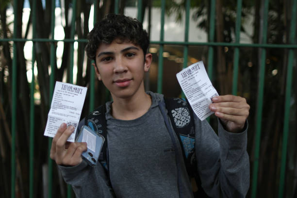 June 2023, Brazil, São Paulo: A boy shows the tikets just bought at the Allianz Parque stadium for "The Eras Tour" by Taylor Swift. After unrest...