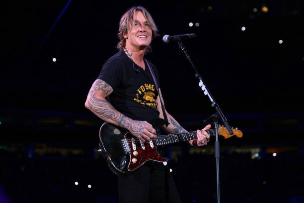 Keith Urban performs onstage at the Concert For Carolina Benefit Concert at Bank of America Stadium on October 26, 2024 in Charlotte, North Carolina.