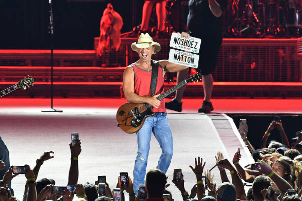 Kenny Chesney performs in concert during "Trip Around The Sun" tour at Mercedes-Benz Stadium on May 26, 2018 in Atlanta, Georgia.