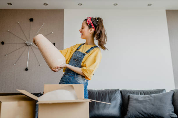 lady shopaholic customer unpacking delivery box, take out pink vase, online shopping shipment - home decoration stock pictures, royalty-free photos & images