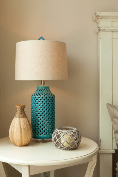 lamp on table in bedroom - home decoration fotografías e imágenes de stock