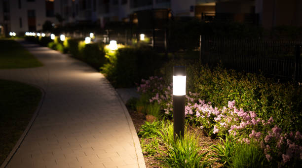 lamps by the sidewalk in an elegant courtyard at night - garden decoration stock pictures, royalty-free photos & images