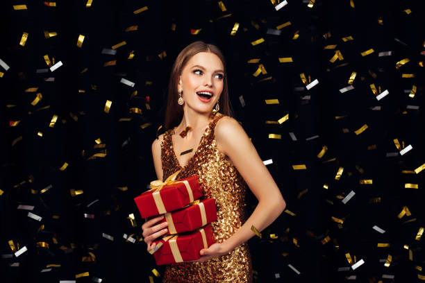 laughing girl with falling confetti - fashion stock pictures, royalty-free photos & images