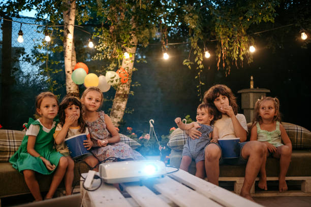 let's watch our favorite cartoon! - garden decoration stockfoto's en -beelden