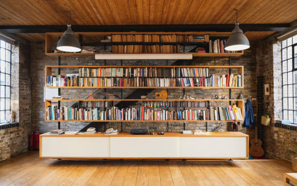 library bookshelves in modern warehouse loft conversion - home decoration stock pictures, royalty-free photos & images