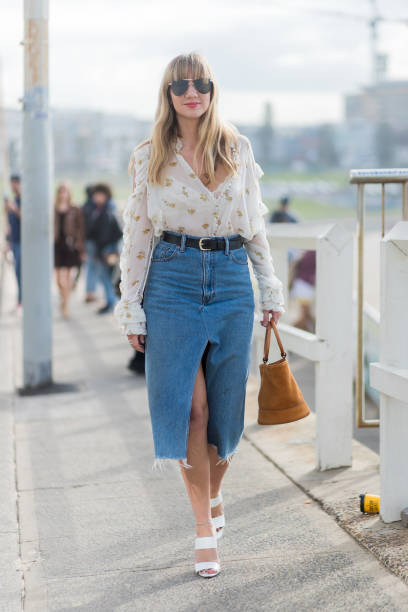 Lisa Aiken wearing a white blouse, denim skirt, sandals outside Ten Pieces at day 5 during Mercedes-Benz Fashion Week Resort 18 Collections at...