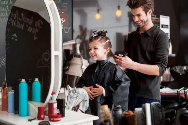 little girl at a hairdresser - hairstyle stock pictures, royalty-free photos & images
