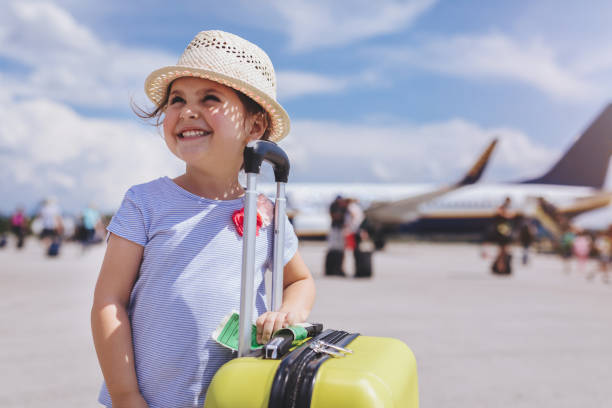 lovely toddler with a yellow coffer - travel stock pictures, royalty-free photos & images