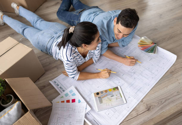 loving couple sketching a design to decorate their new house - home decoration stock pictures, royalty-free photos & images