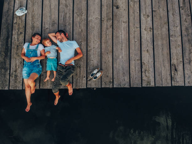 loving family on a lake trip - travel stock pictures, royalty-free photos & images