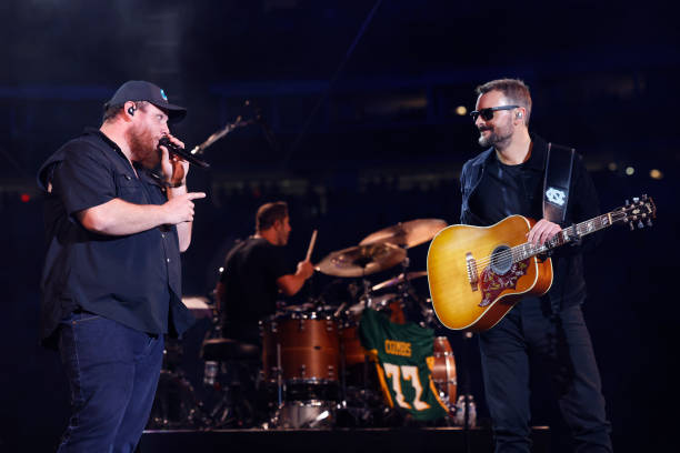 Luke Combs and Eric Church perform onstage at the Concert For Carolina Benefit Concert at Bank of America Stadium on October 26, 2024 in Charlotte,...