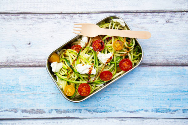 lunch box with zoodles (no plastic) - junk food stock pictures, royalty-free photos & images