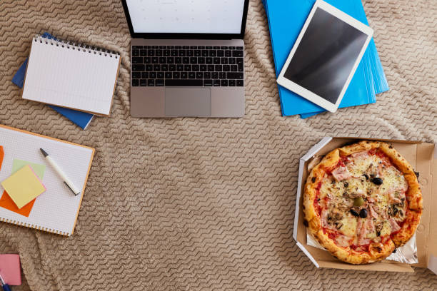 lunch break during working from home! - junk food stock pictures, royalty-free photos & images