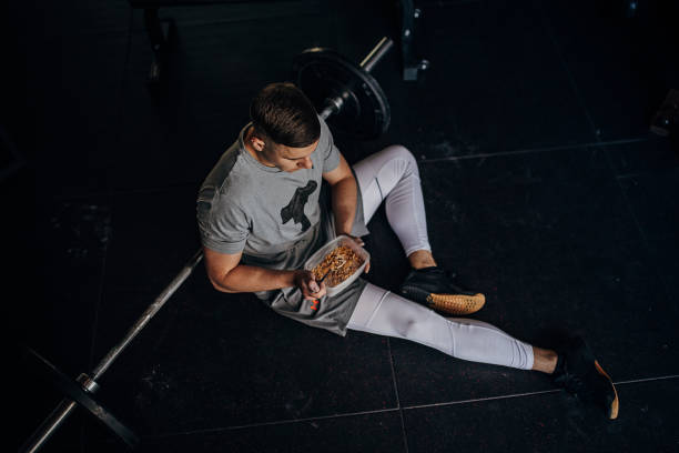 lunch break in gym - food stock pictures, royalty-free photos & images